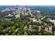 Scenic aerial view of property nestled in a lush, tree-filled landscape with a cityscape backdrop at 2769 Peachtree Ne Rd # 4, Atlanta, GA 30305