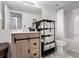 Bright bathroom with a wood vanity, tiled floors, and a shower-tub combination at 2870 Pharr Court S Nw # 2006, Atlanta, GA 30305