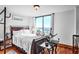 Comfortable bedroom with hardwood floors, large windows, and plush bedding at 2870 Pharr Court S Nw # 2006, Atlanta, GA 30305