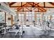 Well-equipped gym with natural light, weight machines, treadmills, and wood-beamed vaulted ceilings at 2870 Pharr Court S Nw # 2006, Atlanta, GA 30305