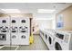 Functional laundry room with multiple washers and dryers, offering convenience and efficiency at 2870 Pharr Court S Nw # 2006, Atlanta, GA 30305