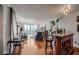 Spacious living area with a bar, hardwood floors, and expansive windows showcasing city views at 2870 Pharr Court S Nw # 2006, Atlanta, GA 30305