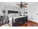Well-lit main bedroom with a large decorative bed frame, ceiling fan, and neutral decor at 2870 Pharr Court S Nw # 2006, Atlanta, GA 30305