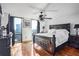 Main bedroom with a large bed, city views, and hardwood floors at 2870 Pharr Court S Nw # 2006, Atlanta, GA 30305
