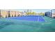Brightly painted tennis court with netting, surrounded by a fence, and views of the city at 2870 Pharr Court S Nw # 2006, Atlanta, GA 30305