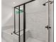 Bathroom with a walk-in shower, soaking tub, black hardware, and marble tile at 313 Canoe Pl, Villa Rica, GA 30180