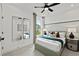Well-lit bedroom with modern decor, neutral colors, and carpet flooring at 313 Canoe Pl, Villa Rica, GA 30180