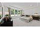 Bright bedroom with a large window, tray ceiling and stylish furnishings at 313 Canoe Pl, Villa Rica, GA 30180