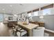 Stylish dining room with pendant lighting and open access to the kitchen at 313 Canoe Pl, Villa Rica, GA 30180