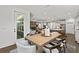 Open dining area connected to the kitchen and living room, with seating for six at 313 Canoe Pl, Villa Rica, GA 30180
