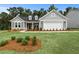 Charming single-Gathering home with manicured lawn and gray siding at 313 Canoe Pl, Villa Rica, GA 30180