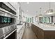 Contemporary kitchen boasts stainless steel appliances, a spacious island, and ample natural light at 313 Canoe Pl, Villa Rica, GA 30180