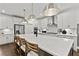 Modern kitchen with stainless steel appliances, quartz countertops, and a large island at 313 Canoe Pl, Villa Rica, GA 30180