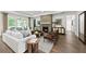 Spacious living room with fireplace, hardwood floors, and lots of natural light at 313 Canoe Pl, Villa Rica, GA 30180