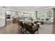 Open-concept living room with kitchen, and lots of natural light at 313 Canoe Pl, Villa Rica, GA 30180