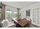 Bright home office with a view, custom shelving, and French doors at 313 Canoe Pl, Villa Rica, GA 30180