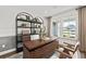 Bright home office featuring wainscoting, large windows, and custom shelving at 313 Canoe Pl, Villa Rica, GA 30180