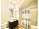 Bathroom with shower/tub combo and modern vanity at 164 Haven Oak Way, Lawrenceville, GA 30044