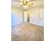 This spacious bedroom features neutral walls and a ceiling fan with integrated lighting at 164 Haven Oak Way, Lawrenceville, GA 30044