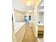 Hallway with bathroom featuring a dual sink vanity and modern lighting at 164 Haven Oak Way, Lawrenceville, GA 30044