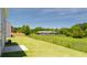 A spacious, well-maintained backyard with a partial fence overlooking trees at 195 Amberjack Trl, Covington, GA 30016