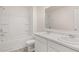 Bright bathroom features double sinks, a large mirror, and a shower-tub combo at 195 Amberjack Trl, Covington, GA 30016