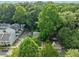 Expansive aerial view of a home nestled among mature trees, offering privacy and a serene setting at 428 Sycamore Dr, Decatur, GA 30030