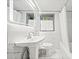 Bright bathroom featuring marble tile, a modern vanity mirror, and shower-tub combo at 428 Sycamore Dr, Decatur, GA 30030