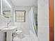 Bathroom featuring white marble tile and a modern vanity sink at 428 Sycamore Dr, Decatur, GA 30030