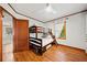 Bedroom features hardwood floors, bunk bed, adjacent to a modern kitchen at 428 Sycamore Dr, Decatur, GA 30030