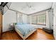 Cozy bedroom featuring hardwood floors, a ceiling fan, and plenty of natural light at 428 Sycamore Dr, Decatur, GA 30030