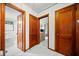 Hallway leading to a bathroom and living room, wood doors, and tiled flooring at 428 Sycamore Dr, Decatur, GA 30030