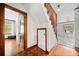 Hallway featuring hardwood floors, a staircase, and a white tile dining area at 428 Sycamore Dr, Decatur, GA 30030