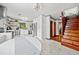 Bright, open kitchen featuring stainless steel appliances and stairs to the second story at 428 Sycamore Dr, Decatur, GA 30030