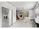 Bright modern kitchen with stainless steel appliances, marble floors, white cabinetry and dining nook at 428 Sycamore Dr, Decatur, GA 30030