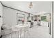 Bright kitchen with marble floors, stainless steel appliances, white cabinetry, and a dining nook at 428 Sycamore Dr, Decatur, GA 30030