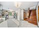 Bright kitchen and dining area with stainless steel appliances, pendant lights and hardwood staircase at 428 Sycamore Dr, Decatur, GA 30030