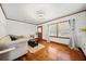 Bright living room featuring detailed wall trim, hardwood floors, and a cozy seating area at 428 Sycamore Dr, Decatur, GA 30030