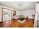 Cozy living room featuring white trim, hardwood floors and an adjacent kitchen at 428 Sycamore Dr, Decatur, GA 30030