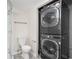 Bathroom featuring a stackable washer and dryer with a toilet and shower at 4962 Preswick Ne Ct, Marietta, GA 30066