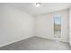 Bedroom with plush carpet, neutral walls, and a window providing natural light at 4962 Preswick Ne Ct, Marietta, GA 30066