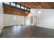 Spacious living room featuring vaulted wood ceilings, new flooring, and abundant natural light at 4962 Preswick Ne Ct, Marietta, GA 30066