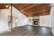 Inviting living room with vaulted wood ceilings, stone fireplace, and new flooring at 4962 Preswick Ne Ct, Marietta, GA 30066