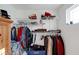 Walk-in closet with clothes hanging and items on shelves offering optimal storage space at 6860 Robinson St, Lithonia, GA 30058