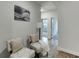 Inviting hallway with stylish seating area and view to the bedroom at 1236 Ainsworth Aly # 37, Sugar Hill, GA 30518