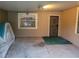 Carport with concrete flooring and secure door at 1767 Thomas St, Decatur, GA 30032