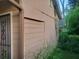 Exterior view of the home's painted siding and door with decorative security bars at 1767 Thomas St, Decatur, GA 30032