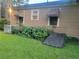 Exterior view of the home showing window awnings and the lawn at 1767 Thomas St, Decatur, GA 30032