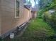 Side view of the home, showcasing siding, windows, and doors leading to the backyard at 1767 Thomas St, Decatur, GA 30032