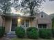 Exterior shot of the home showcasing the secure front door and window features at 1767 Thomas St, Decatur, GA 30032